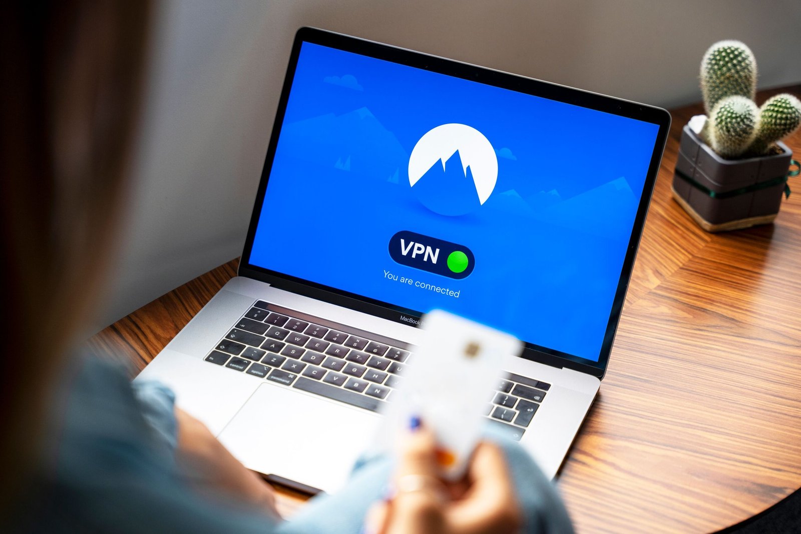 Laptop displaying a VPN connection used by a digital nomad working remotely