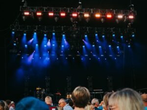 Concert stage lights above a crowd at a K-pop show