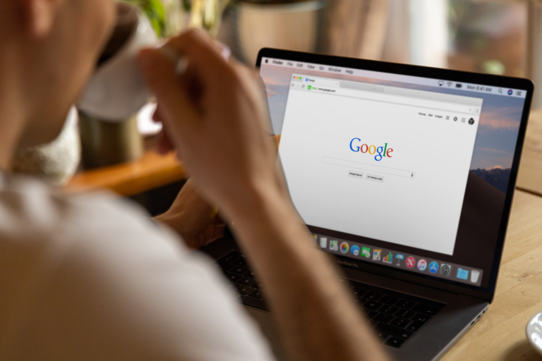 A laptop web browser with many open tabs using memory