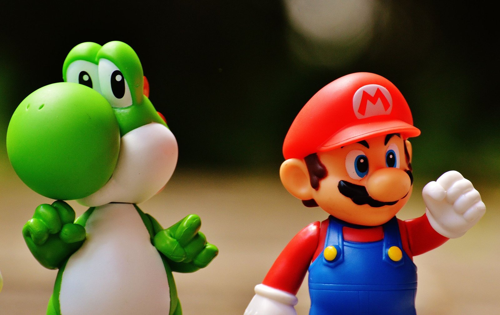 Collectible vinyl figures displayed together on a shelf for sale