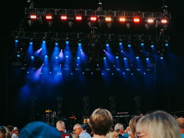 Concert crowd under stage lights at a music festival