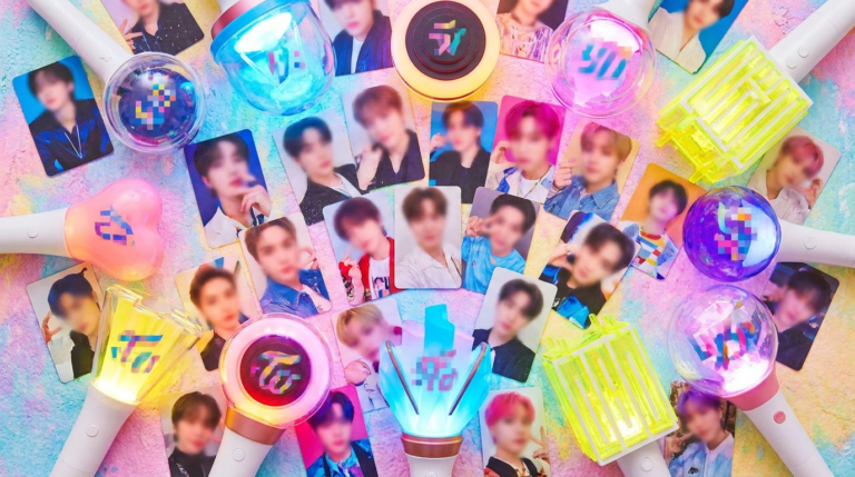Colorful array of K-pop album photocards and lightsticks