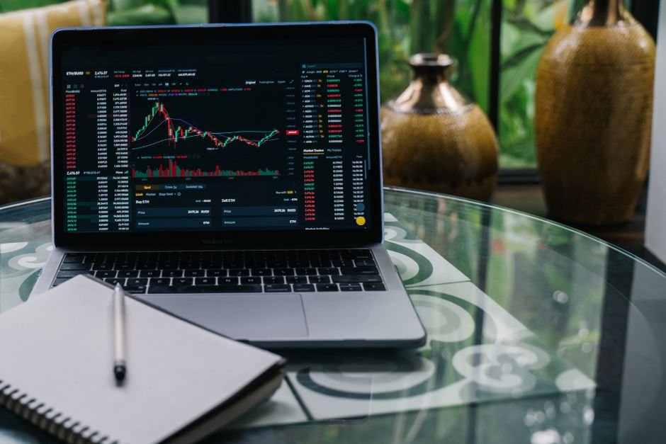 Laptop screen showing cryptocurrency charts, representing liquid staking token yield tracking
