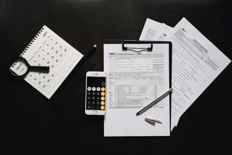 Tax forms, a calculator and a calendar laid out for side hustle tax planning in 2026