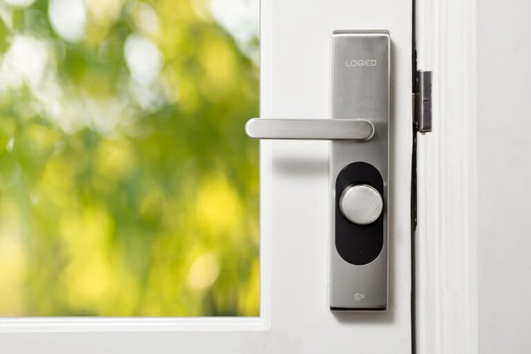 Sleek smart lock installed on a white apartment door