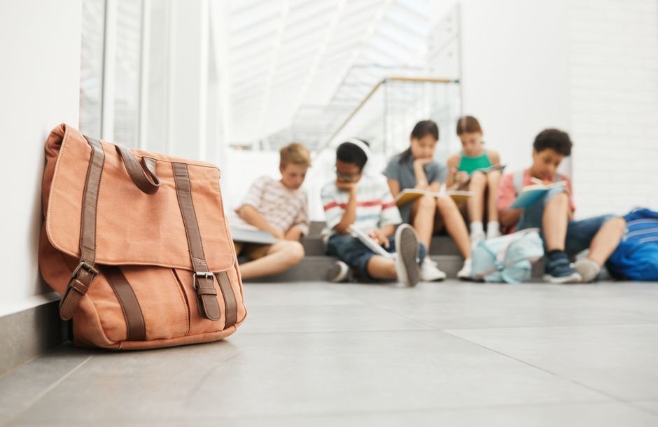 Notebooks pens and school supplies laid out for back to school shopping