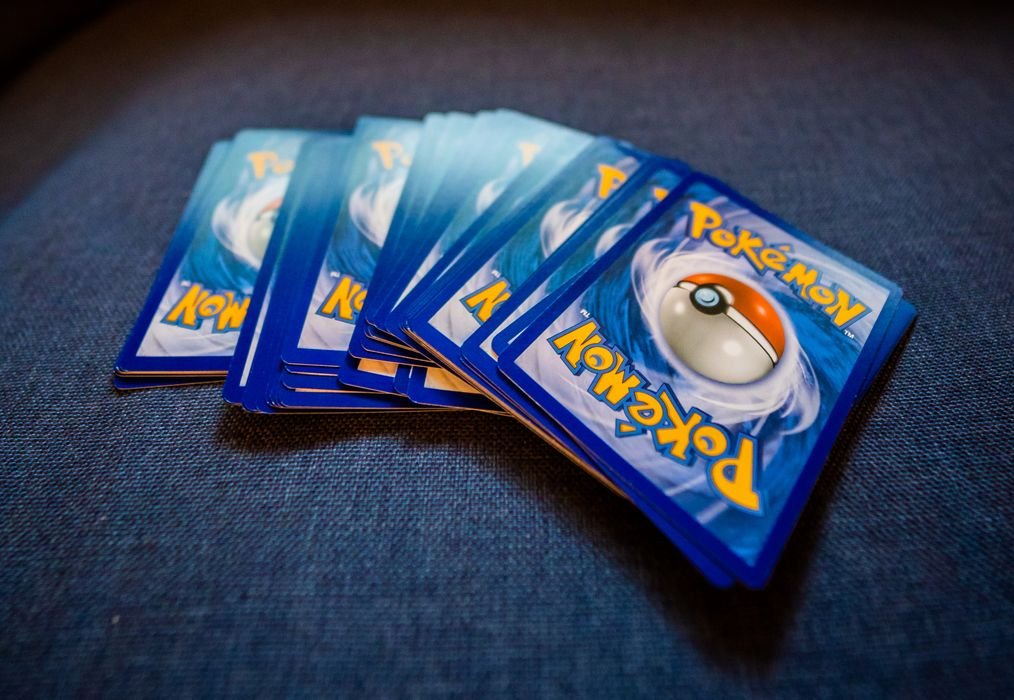 Trading cards sorted and sleeved before choosing a grading service