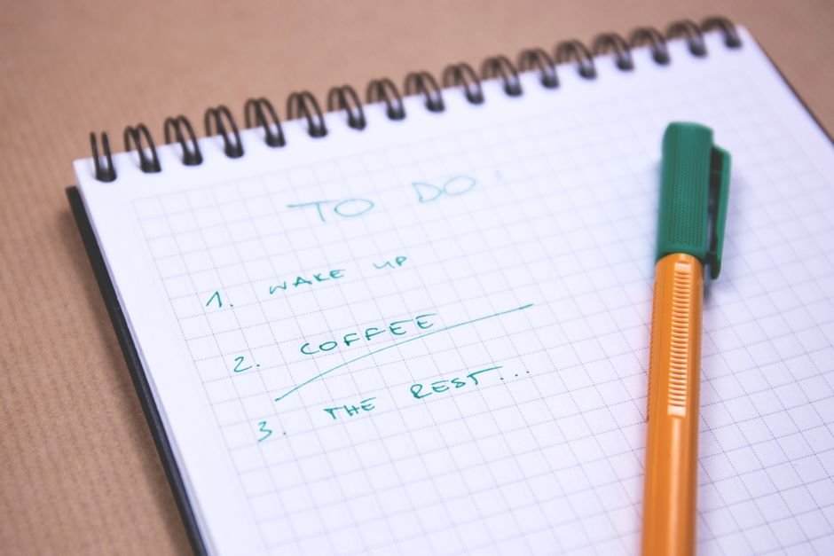 Notebook and pen used to write a checklist for comparing AI models by task in 2026