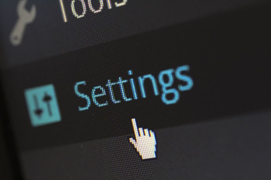 Computer screen showing a settings icon, representing the Windows Settings repair and reset step