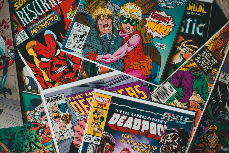 Stack of colorful comic books representing CGC comic book grading submissions