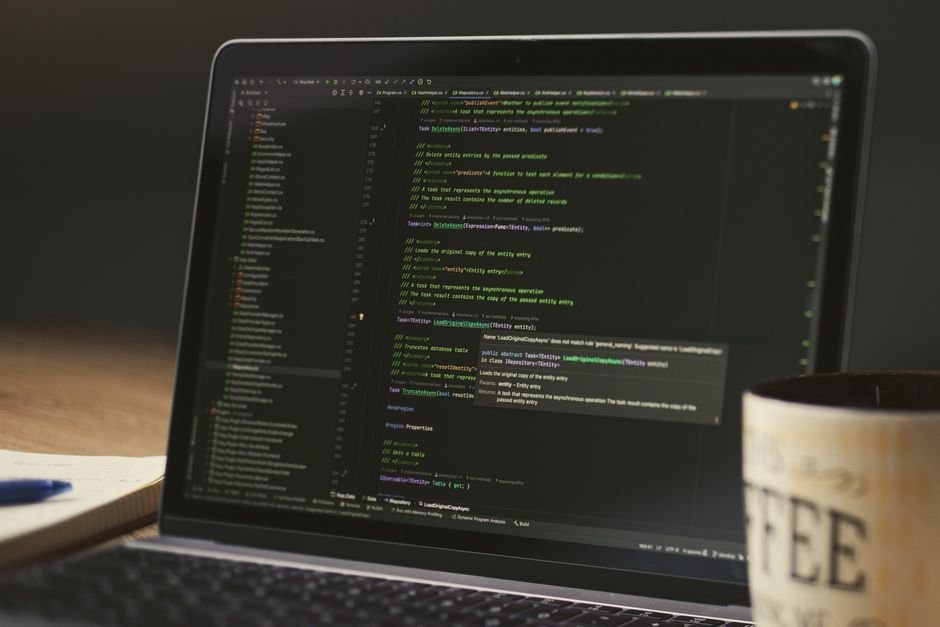 Laptop showing a dark-mode code editor during a long coding session, representing a Codex usage window