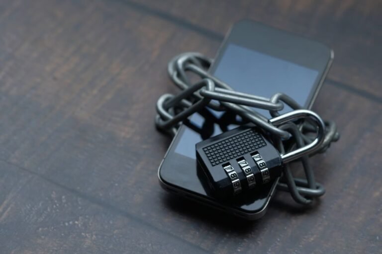 Smartphone secured with a padlock and chain, representing cryptocurrency wallet security after 2026 hacks