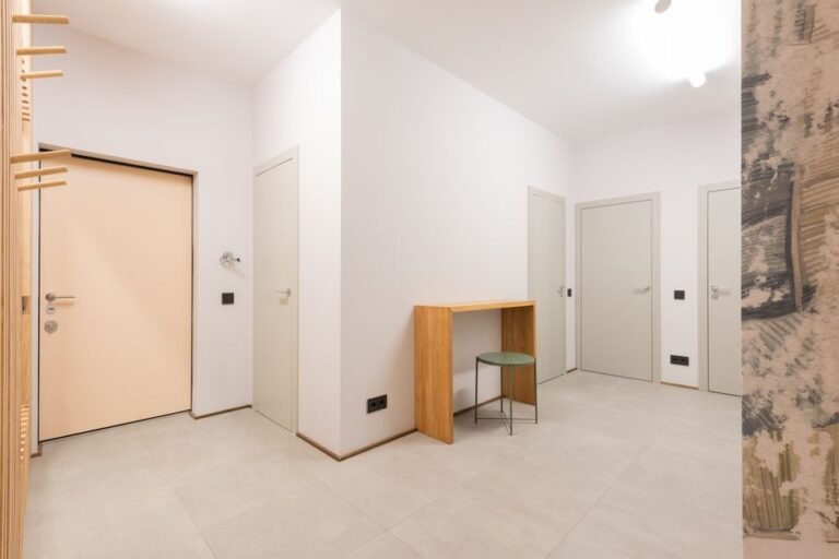 Apartment hallway with multiple doors, the kind of shared space that triggers dog barking at hallway noises