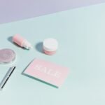 Pastel-colored K-beauty skincare products and boxes arranged on a light background