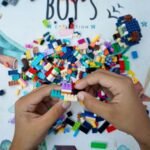 Colorful LEGO bricks being assembled, representing LEGO sets as a collectible investment in 2026