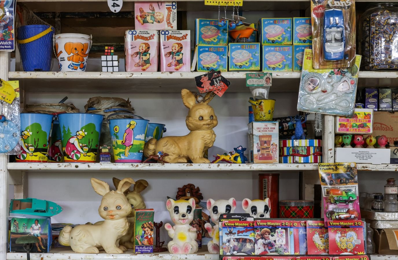 Vintage toy shop shelf displaying retro boxed toys, representing the secondary collectibles market