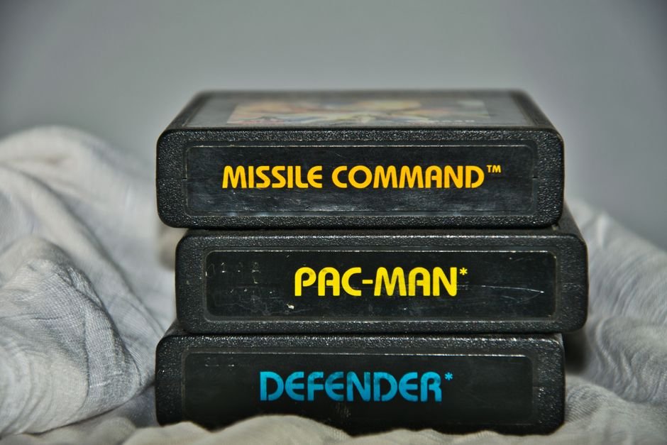Vintage Atari game cartridges for Missile Command, Pac-Man, and Defender