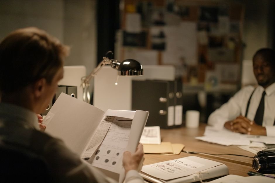 Interrogation room scene representing a psychological thriller mystery