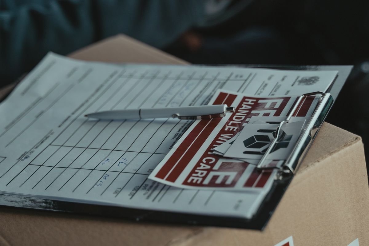 Clipboard with a shipping label and package ready for a return