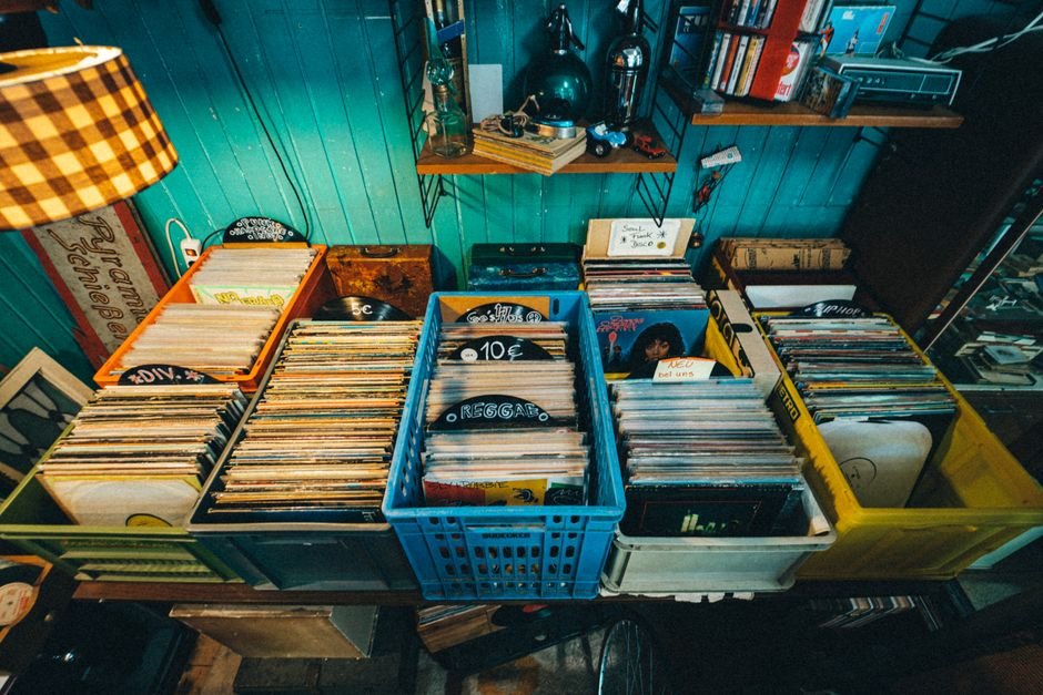 Wooden crates full of vinyl records at a thrift store, ready for sorting