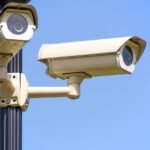 Outdoor security camera mounted on a house wall