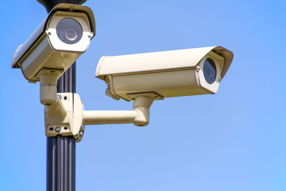 Outdoor security camera mounted on a house wall