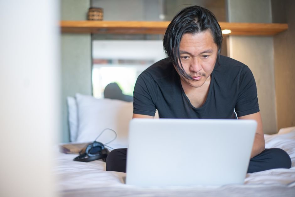 Freelancer comparing chatbot builder pricing plans on a laptop