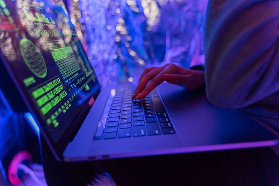 Person using a laptop, troubleshooting a login authentication error