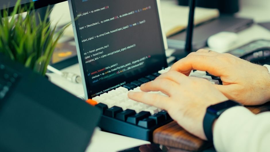 Developer typing commands in a terminal window to update AI coding agent software