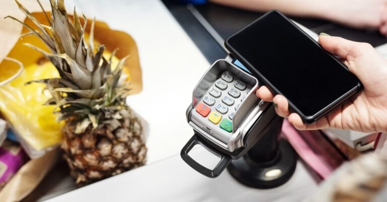 Contactless card payment at a counter - ether.fi Cash cashback in ETHFI