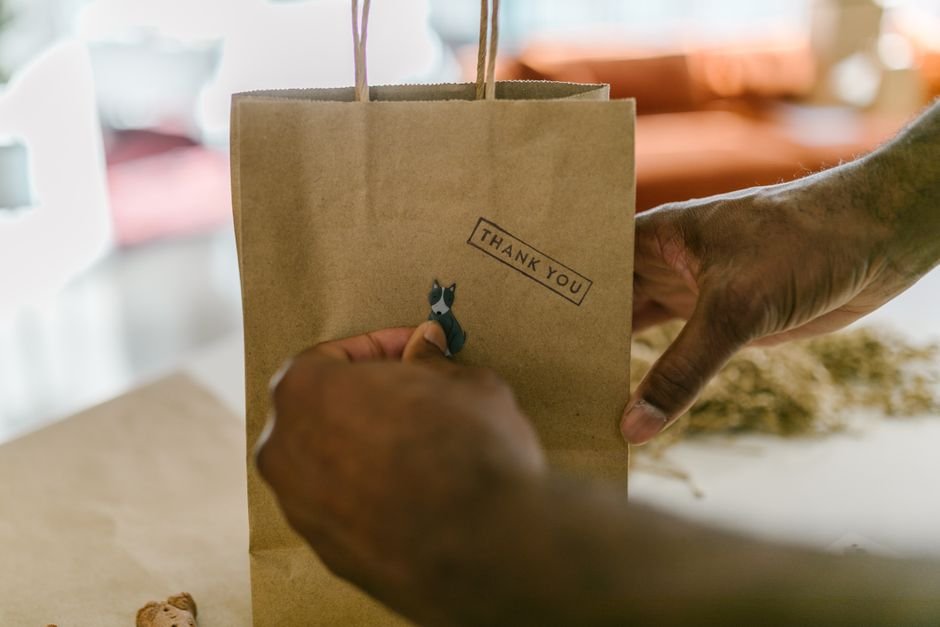 Small handmade goods seller packaging an order for an Etsy shop