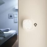 Smart home hub device on a table representing a Thread border router for Matter devices