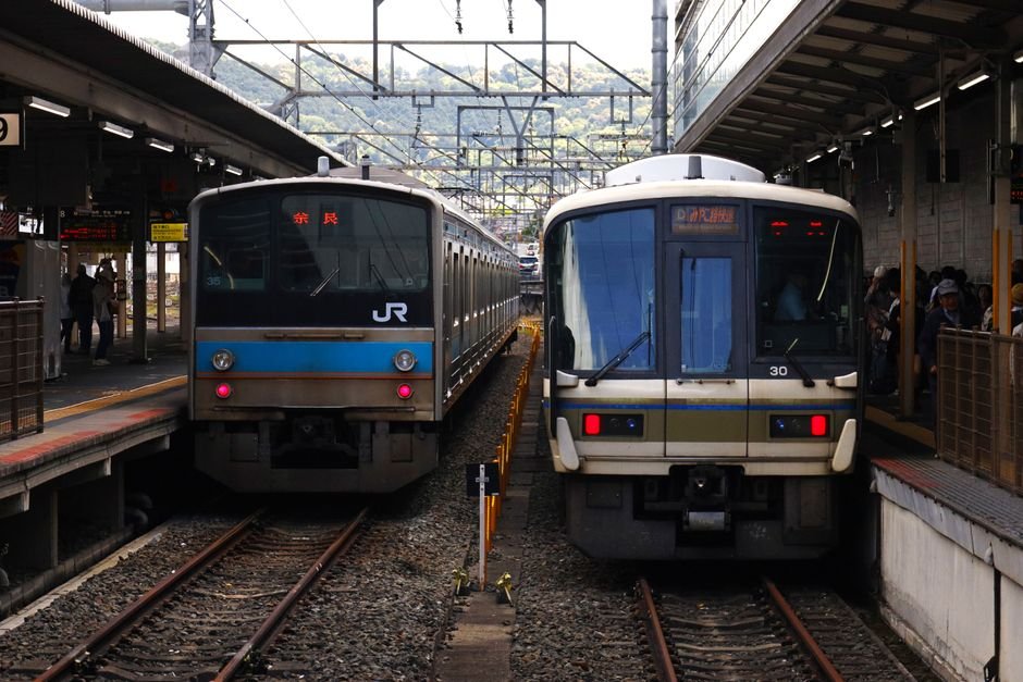 Japan train station platform with a shinkansen bullet train arriving