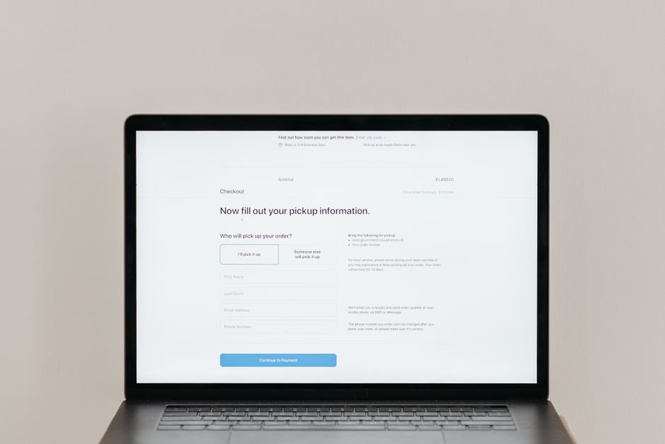 Laptop screen showing an online checkout form for a pre-order