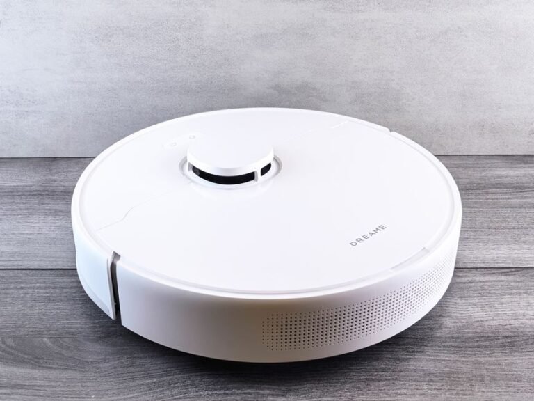 Modern robot vacuum cleaner on wood floor, Roborock Saros 20 Flow comparison