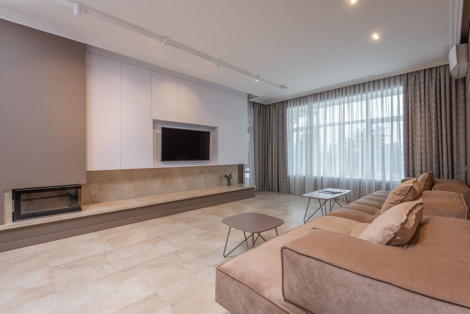 Clean modern living room floor where a robot vacuum would operate