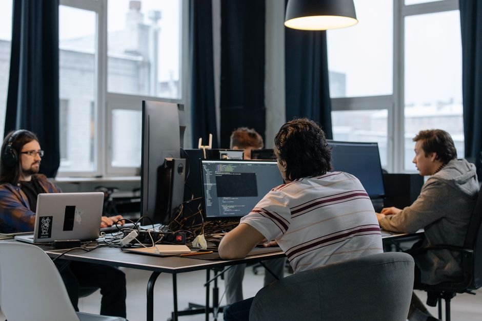 Small team reviewing new AI model options on a laptop