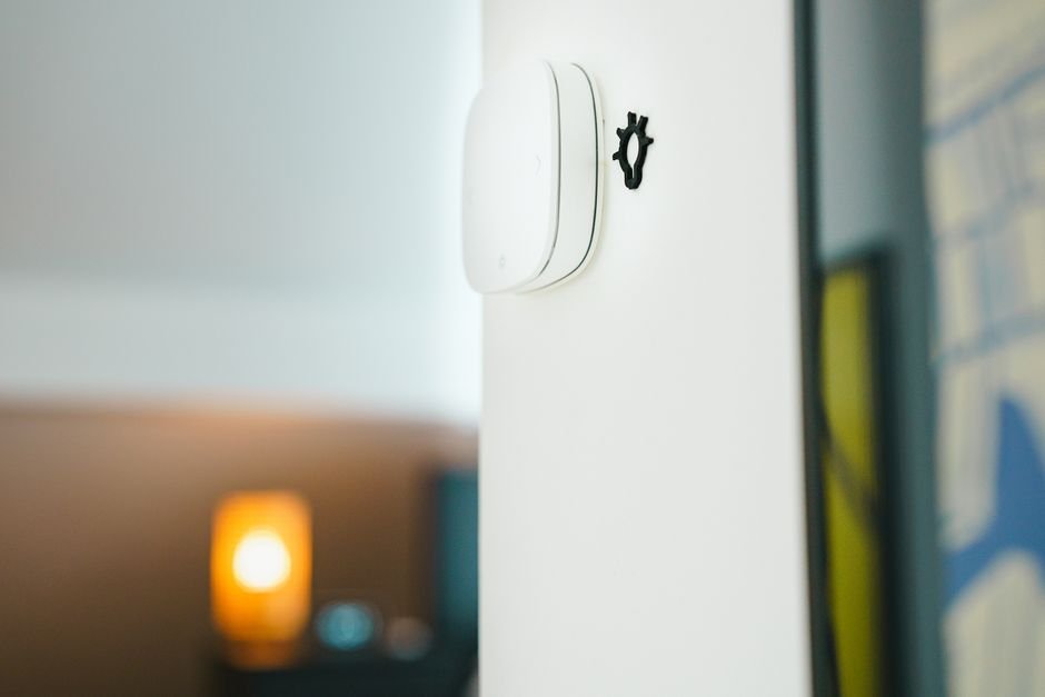 Smart light switch on a wall, representing a Zigbee-connected device that can lose sync after a hub firmware update