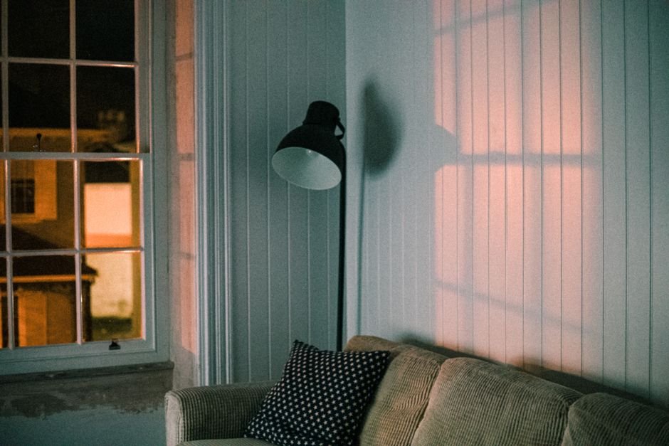 Warm living room lamp light in the evening, representing Adaptive Lighting color temperature