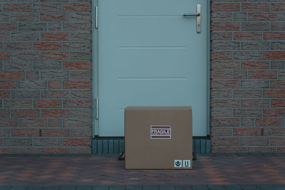 Delivered cardboard package at a front door