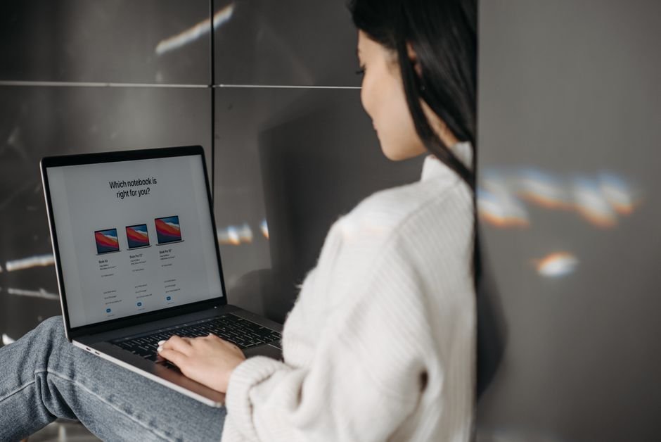 Comparing listings on a laptop before buying