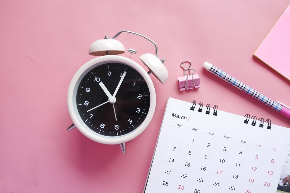 A calendar and clock marking a deadline