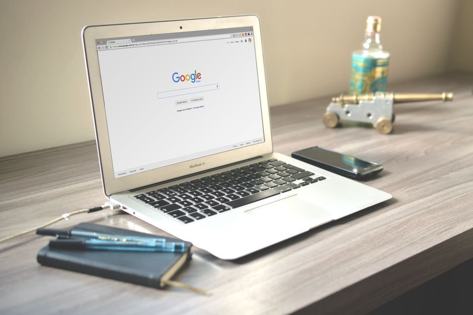 Laptop with a browser open next to a smartphone, the web fallback for ChatGPT Android errors