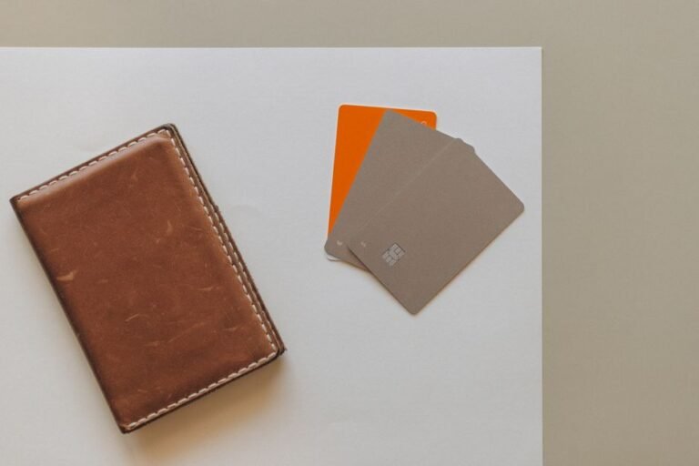 Leather wallet and credit cards on a minimalist background