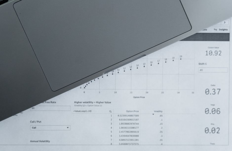 Laptop with data sheets, representing a Copilot activity history CSV export from the Microsoft privacy dashboard