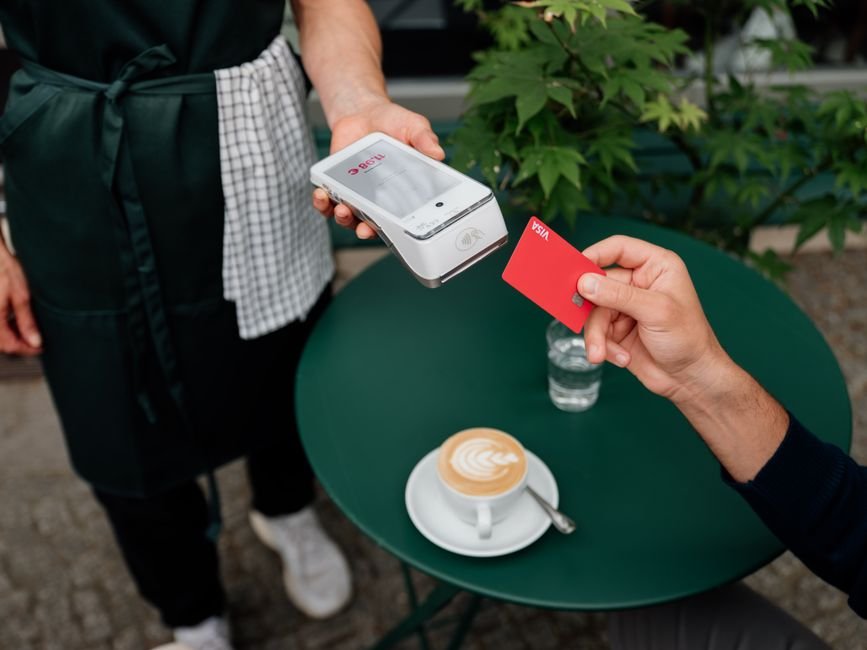 Contactless card payment at a cafe card terminal