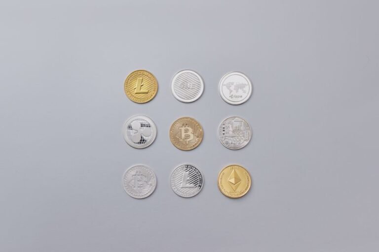 Cryptocurrency coins beside a hardware wallet for moving delisted tokens