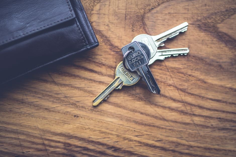 Hardware wallet and recovery keys on a desk