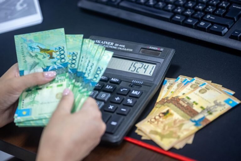 Calculator and currency notes on a desk