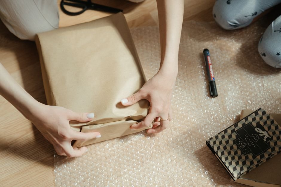 Seller packing a parcel to ship a resale order